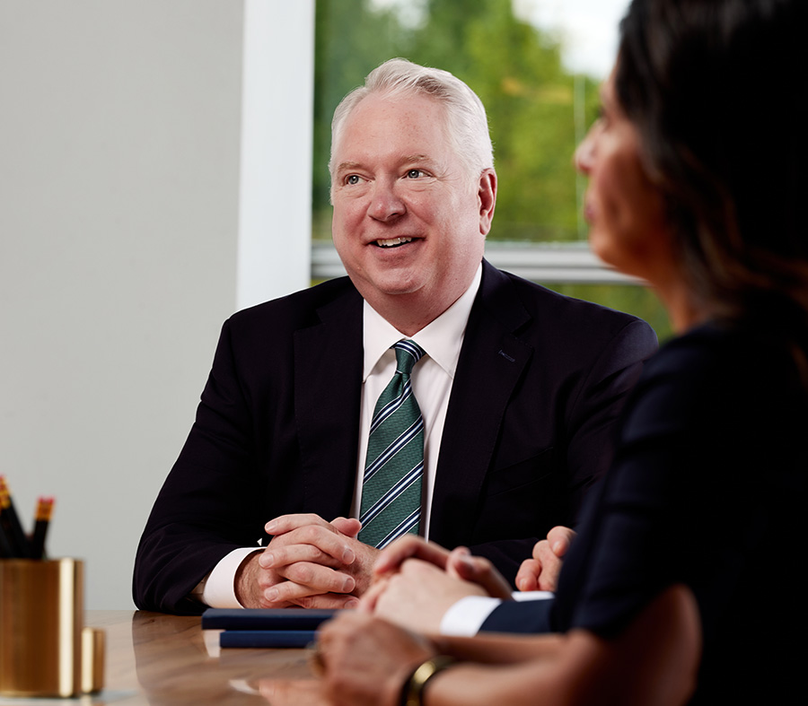 Image of an attorney in a meeting.